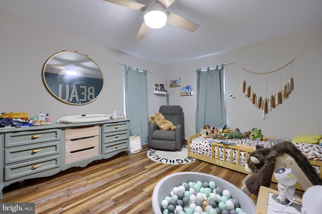 bedroom featuring hardwood / wood-style floors and ceiling fan