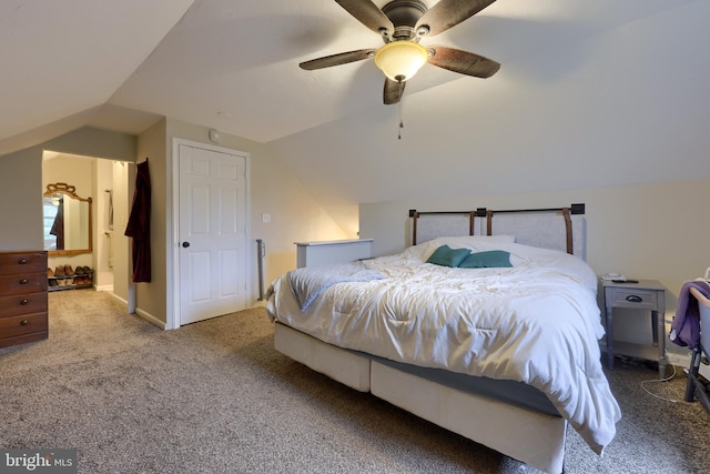 carpeted bedroom featuring vaulted ceiling and ceiling fan