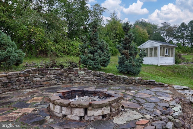 view of patio with a fire pit