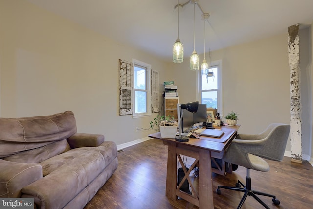 home office featuring a notable chandelier and dark hardwood / wood-style flooring