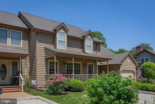 view of front of home featuring a garage and covered porch