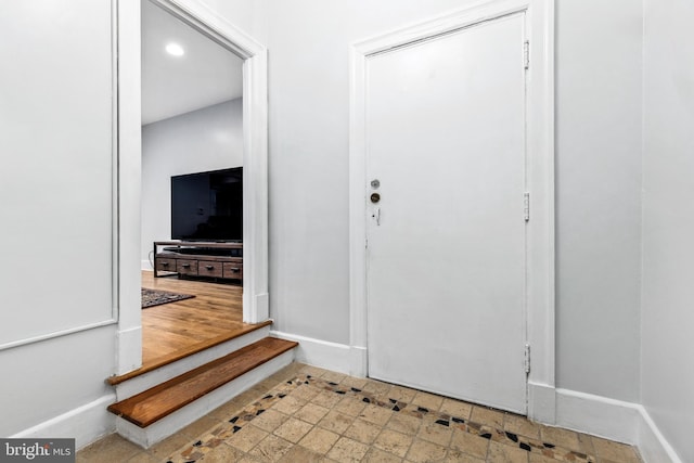 entrance foyer featuring wood-type flooring