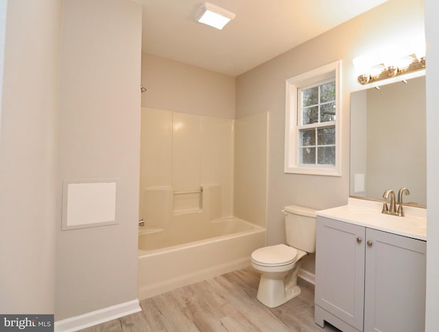 full bathroom with toilet, bathing tub / shower combination, wood-type flooring, and vanity