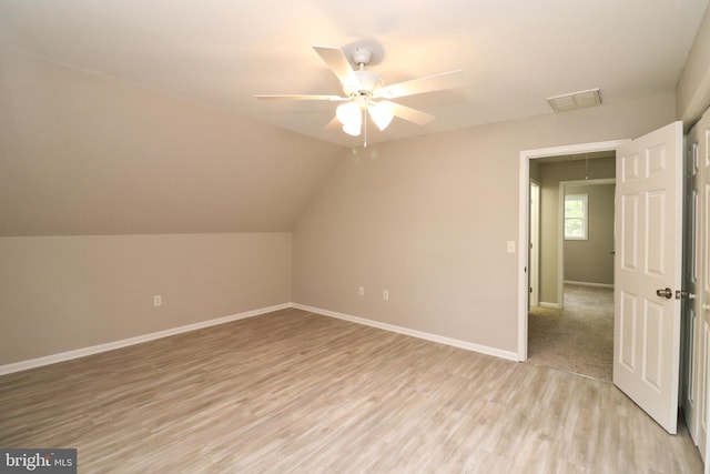 bonus room with ceiling fan, light wood-type flooring, and vaulted ceiling