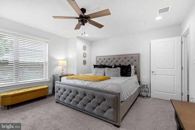 carpeted bedroom featuring recessed lighting, visible vents, and ceiling fan