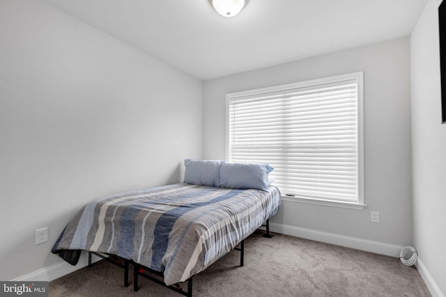 bedroom featuring light carpet