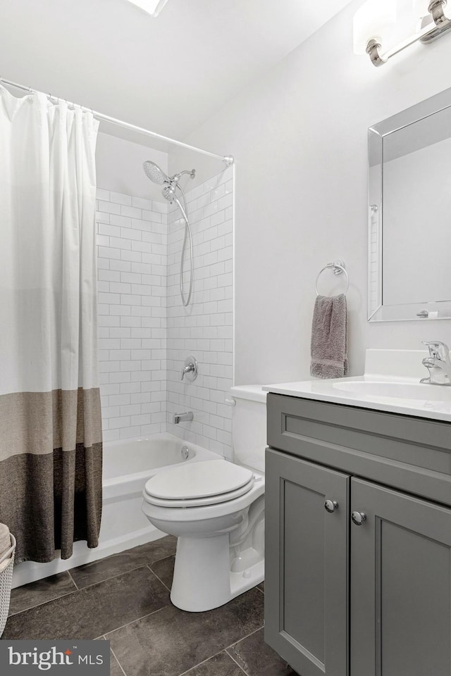 bathroom featuring shower / tub combo with curtain, vanity, and toilet