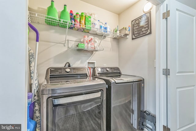 washroom with laundry area and washer and clothes dryer