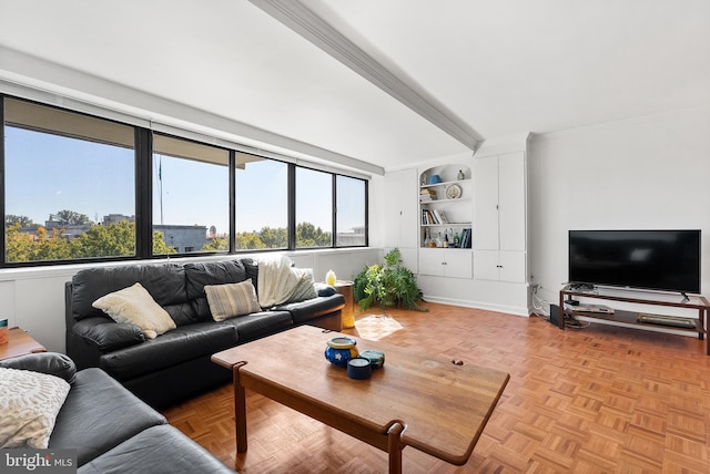 living room with crown molding, built in features, and light parquet flooring