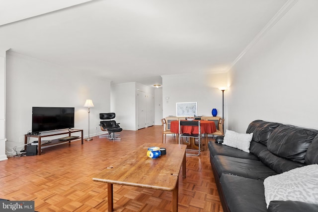 living room featuring parquet flooring and ornamental molding