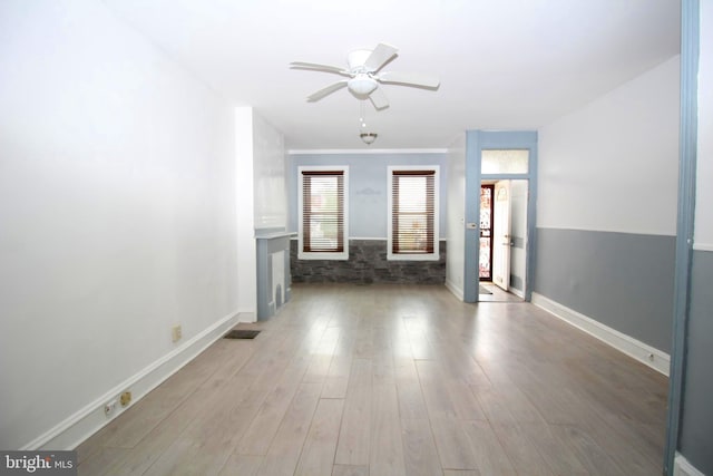 spare room featuring ceiling fan and hardwood / wood-style flooring