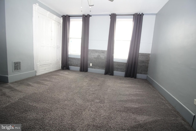 carpeted empty room featuring a healthy amount of sunlight