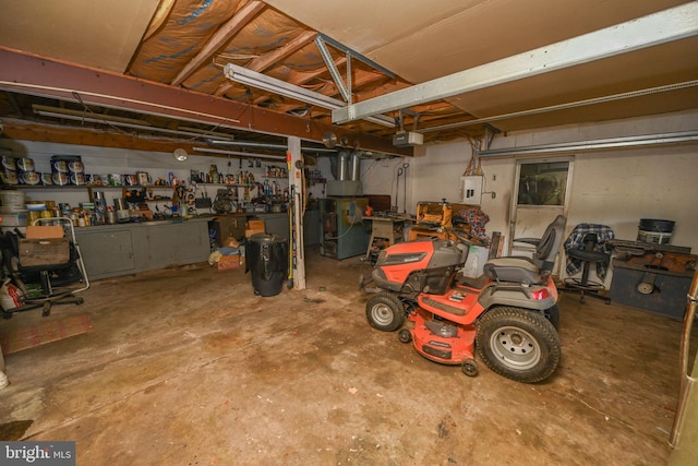 garage featuring a garage door opener and a workshop area