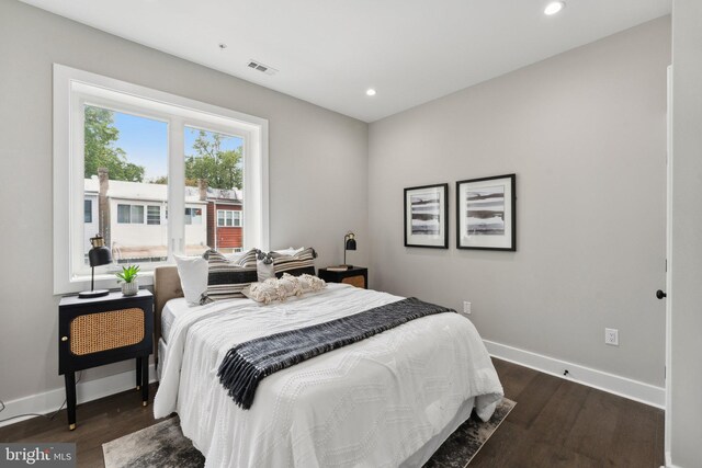 bedroom featuring dark hardwood / wood-style flooring