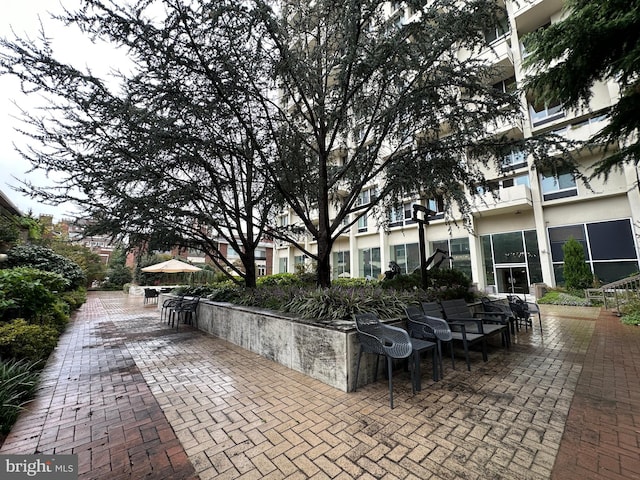view of property's community featuring a patio area