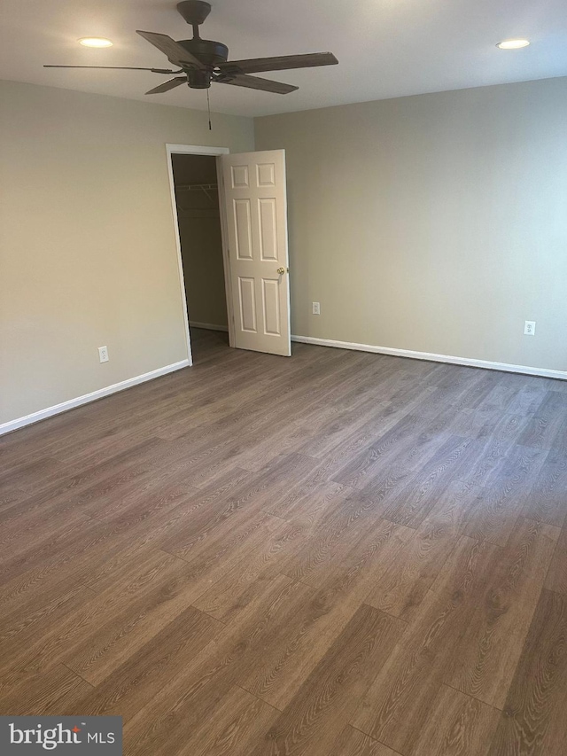 interior space featuring ceiling fan and dark wood-type flooring