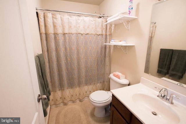 full bathroom featuring shower / tub combo, tile patterned floors, vanity, and toilet