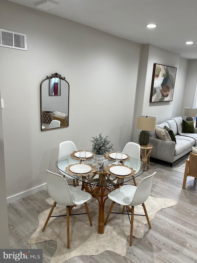 dining space featuring light hardwood / wood-style floors