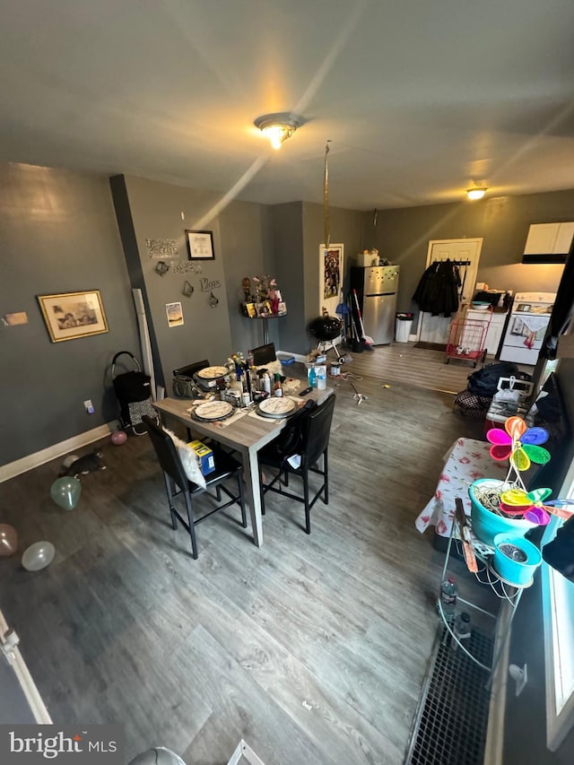 dining area with hardwood / wood-style flooring