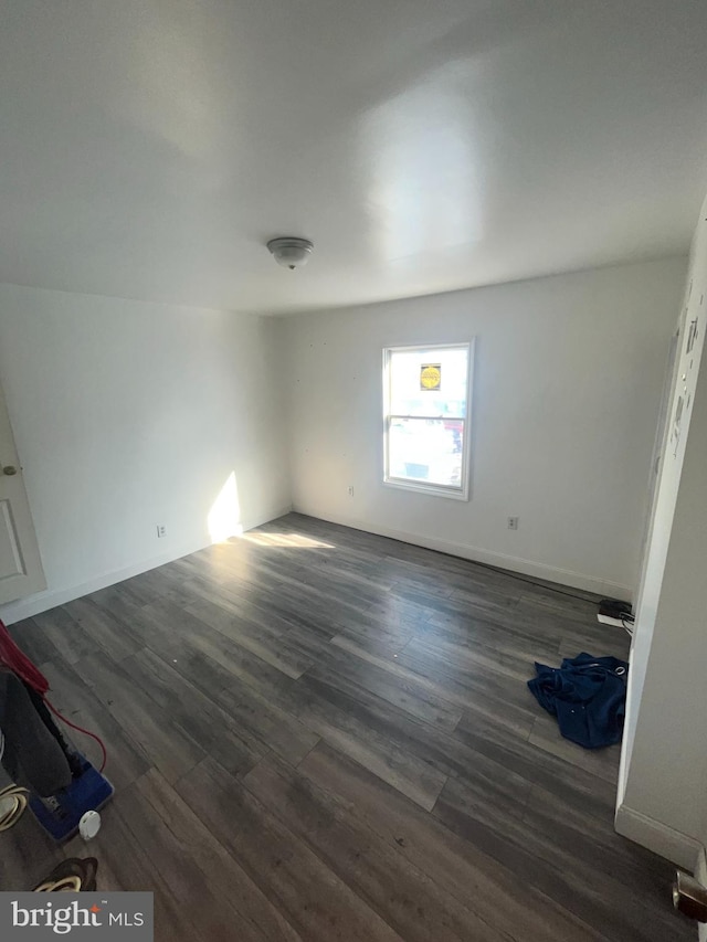 unfurnished room featuring dark hardwood / wood-style floors