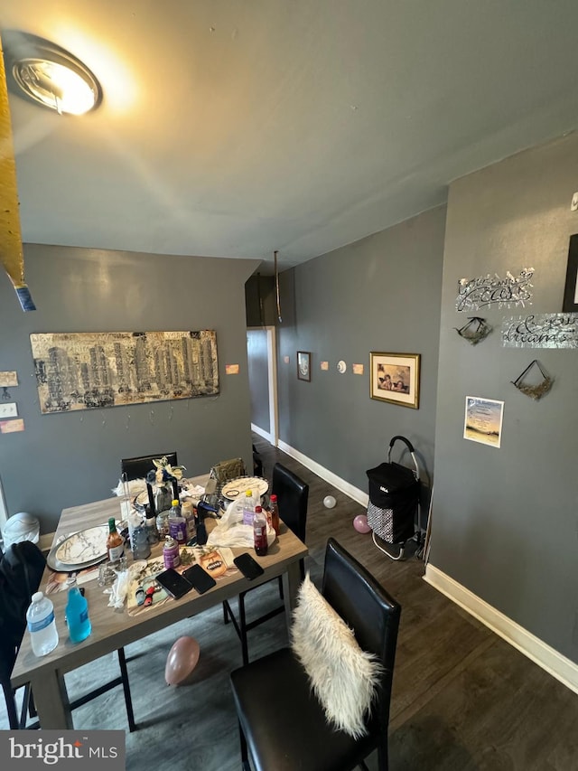 dining area with dark wood-type flooring