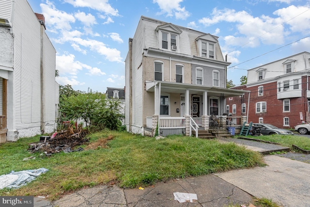 view of front of home with a front lawn and a porch