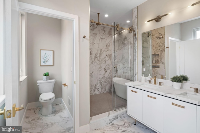 bathroom with a shower with shower door, vanity, and toilet