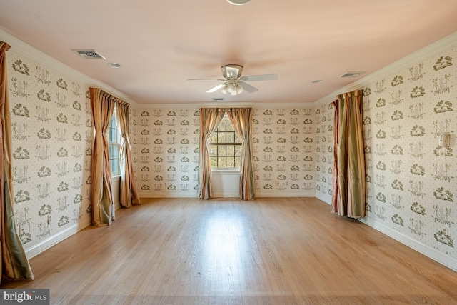 unfurnished room featuring light wood-type flooring, ceiling fan, and ornamental molding