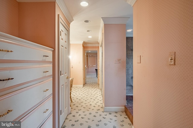 corridor featuring crown molding and light tile patterned floors