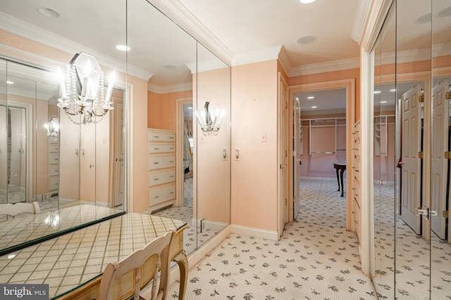 bathroom featuring a notable chandelier and ornamental molding