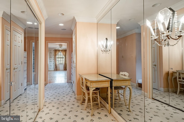 dining space with ceiling fan with notable chandelier, light hardwood / wood-style floors, and ornamental molding