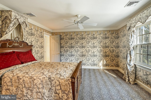 carpeted bedroom with ceiling fan and crown molding