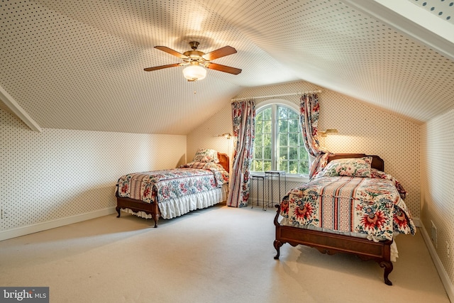 bedroom with carpet floors, ceiling fan, and lofted ceiling