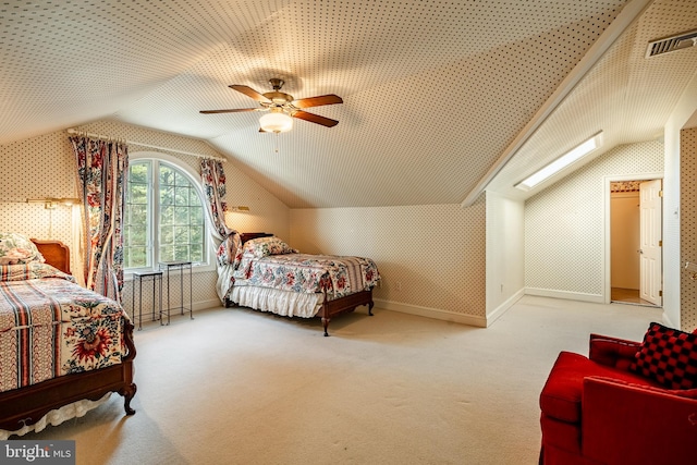 bedroom featuring ceiling fan, carpet floors, and vaulted ceiling