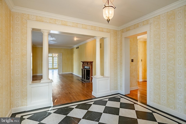 unfurnished living room with crown molding, wood-type flooring, and a notable chandelier