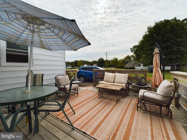 deck featuring outdoor lounge area