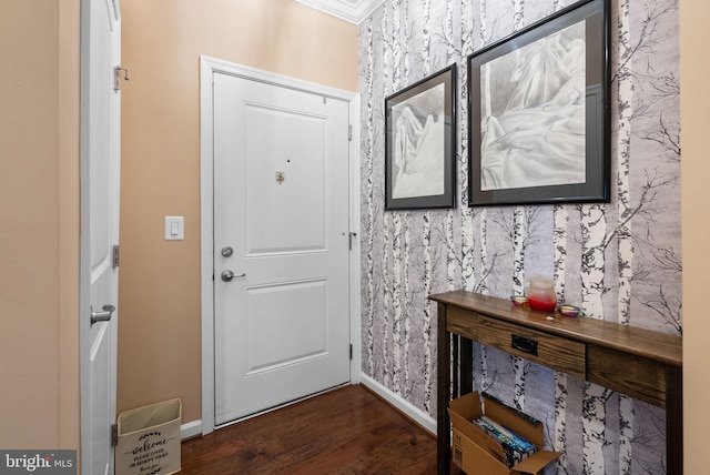 entryway with ornamental molding and dark wood-type flooring