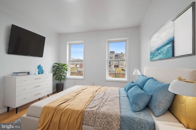 bedroom with light hardwood / wood-style floors