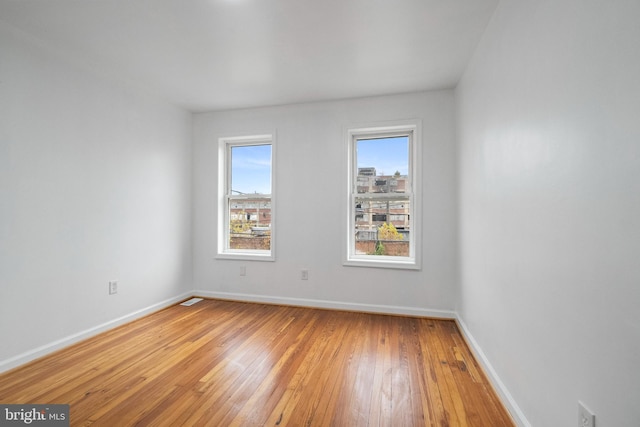 empty room featuring wood-type flooring