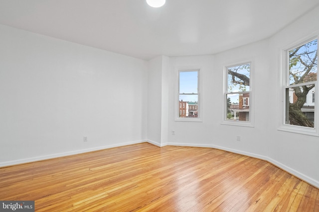 unfurnished room with light hardwood / wood-style floors