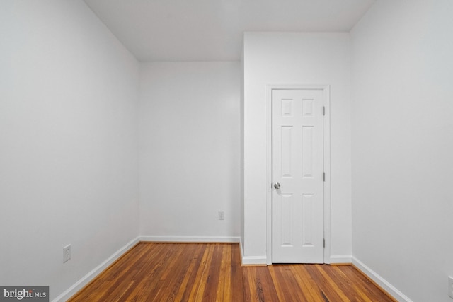 empty room with wood-type flooring