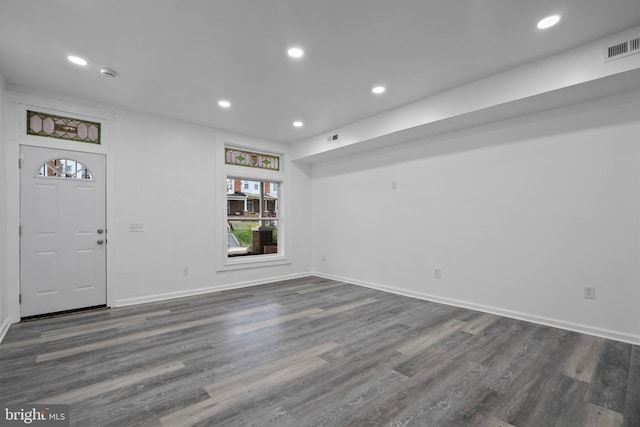 spare room featuring dark wood-type flooring