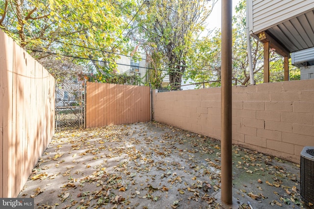 view of yard with a patio and central air condition unit