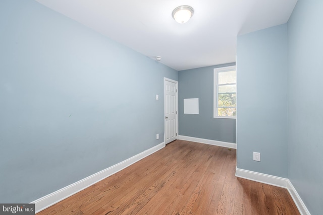 spare room with light hardwood / wood-style floors