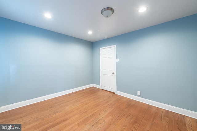 unfurnished room with light hardwood / wood-style flooring