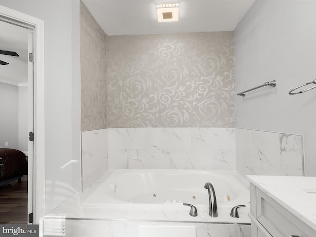 bathroom with vanity, wood-type flooring, and a washtub