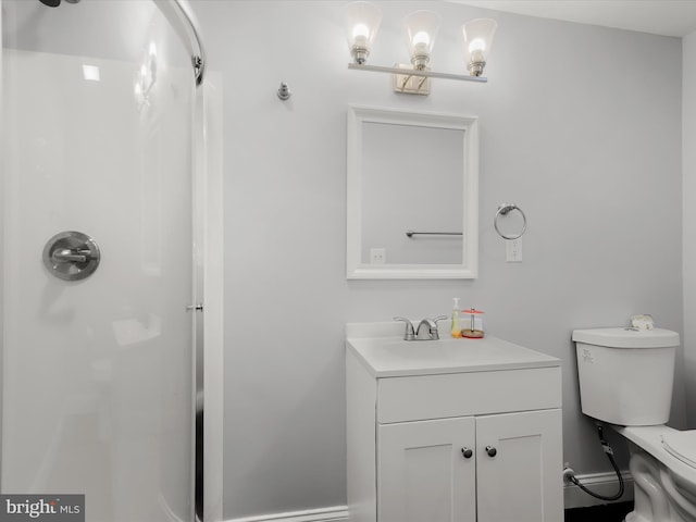 bathroom with vanity, toilet, and walk in shower