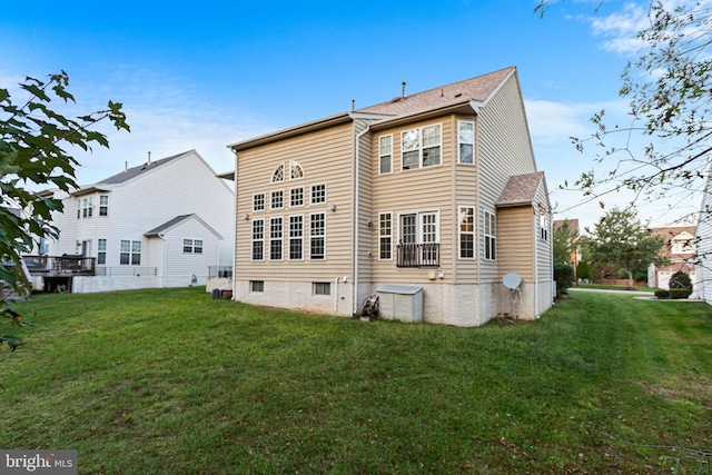 rear view of house with a lawn