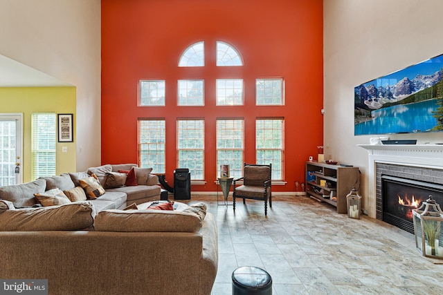 living room with a high ceiling and a wealth of natural light