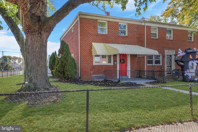 view of front of home featuring a front lawn